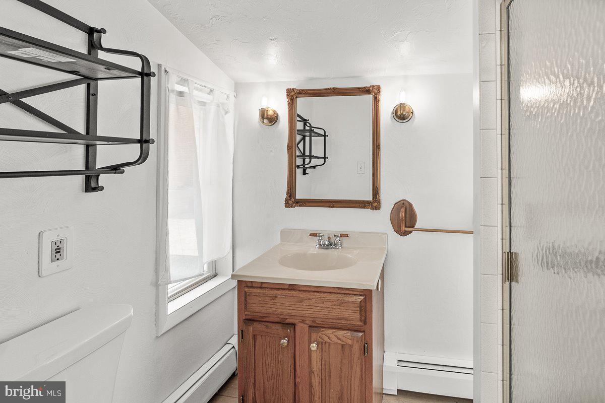 201 East Main Street Fairfield, PA 17320 - Photo 10 of 44 a bathroom with a sink and a mirror