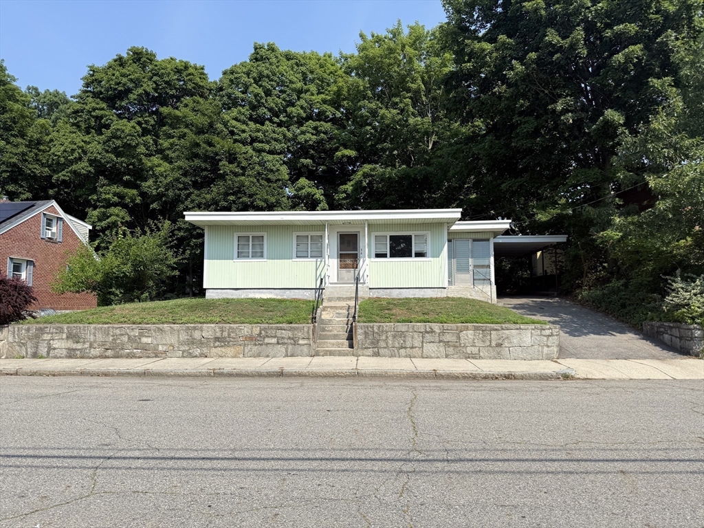 36 5th Avenue Lowell, MA 01854 - Photo 2 of 16 front view of house with a small yard