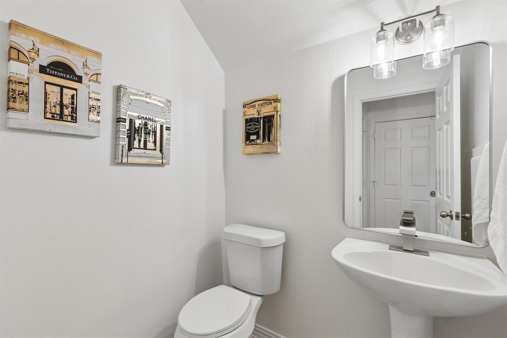 2916 Durango Place Bedford, TX 76021 - Photo 25 of 30 Lower level half bath. This one is a stunner! New fixtures, new mirror, new toilet, new flooring. NEW NEW NEW!