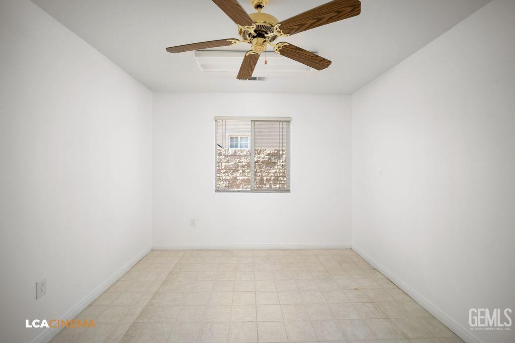 Undisclosed Address Bakersfield, CA 93312 - Photo 14 of 23 an empty room with a window and a fan