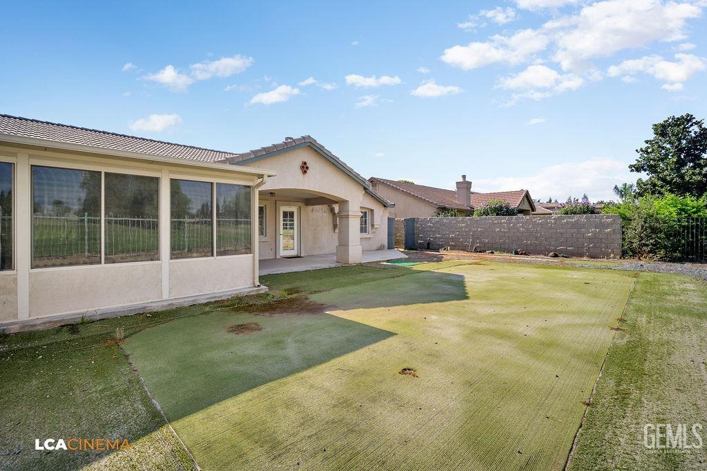 Undisclosed Address Bakersfield, CA 93312 - Photo 16 of 23 a view of house with swimming pool and yard