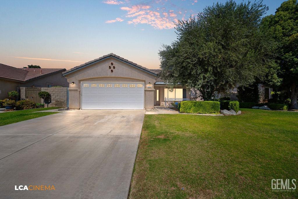 Undisclosed Address Bakersfield, CA 93312 - Photo 2 of 23 a front view of a house with a yard