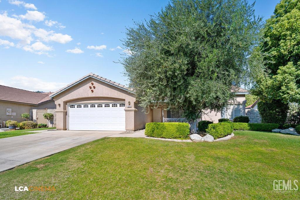 Undisclosed Address Bakersfield, CA 93312 - Photo 3 of 23 a view of a house with a yard