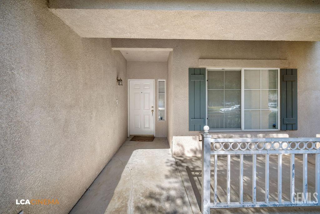Undisclosed Address Bakersfield, CA 93312 - Photo 4 of 23 a view of a front door of a house