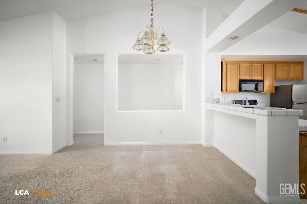 Undisclosed Address Bakersfield, CA 93312 - Photo 5 of 23 a view of a kitchen with microwave and windows