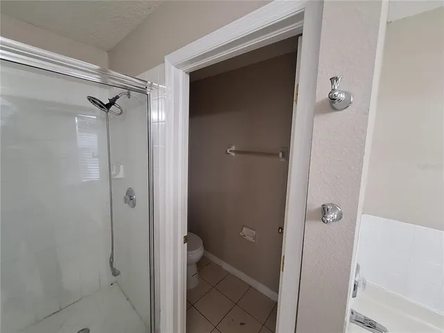 a bathroom with a granite countertop shower mirror and a sink