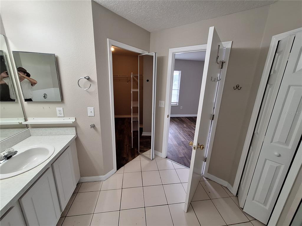 27854 Breakers Drive Zephyrhills, FL 33544 - Photo 13 of 16 a bathroom with a sink toilet and shower