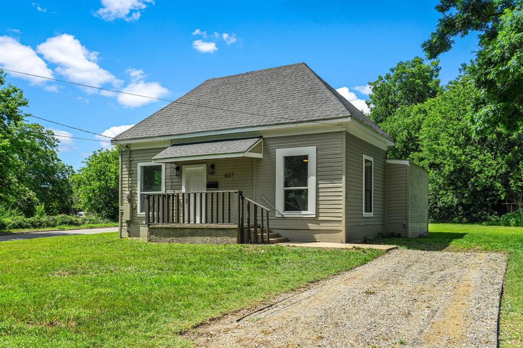 827 West Ellis Street Sherman, TX 75092 - Photo 1 of 5 a front view of a house with a garden