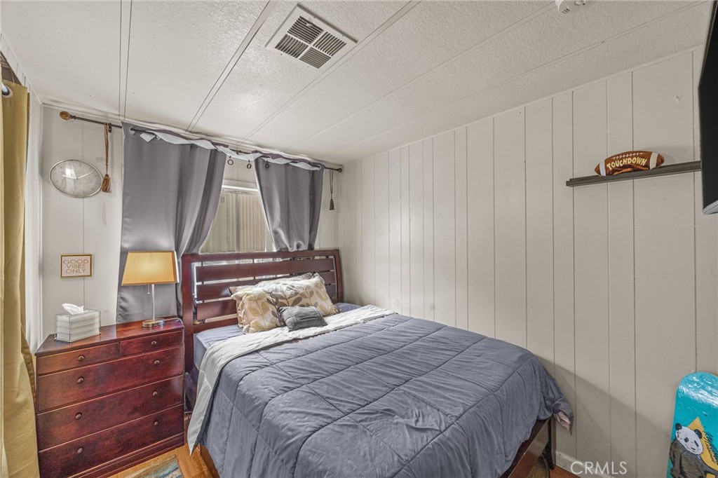 5700 Carbon Canyon Road, Unit 42 Brea, CA 92823 - Photo 15 of 23 a bedroom with a bed and a mirror