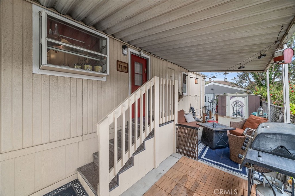5700 Carbon Canyon Road, Unit 42 Brea, CA 92823 - Photo 17 of 23 a view of a porch with furniture and floor to ceiling window