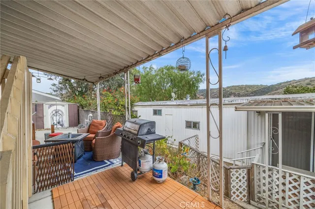a view of living room with furniture and floor to ceiling window