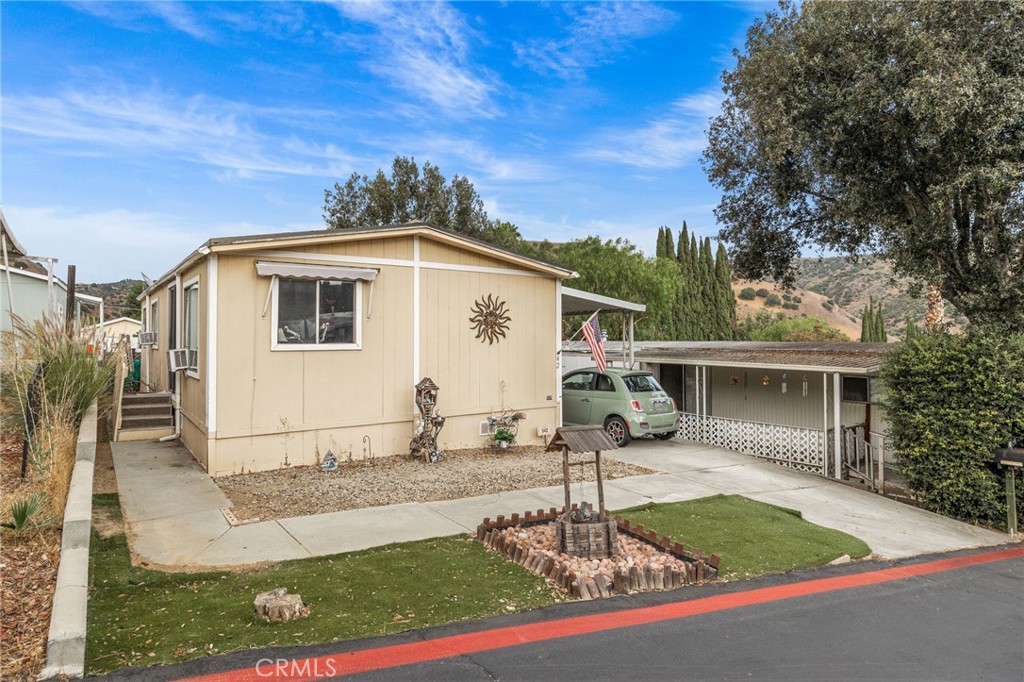 5700 Carbon Canyon Road, Unit 42 Brea, CA 92823 - Photo 4 of 23 a front view of a house with garden