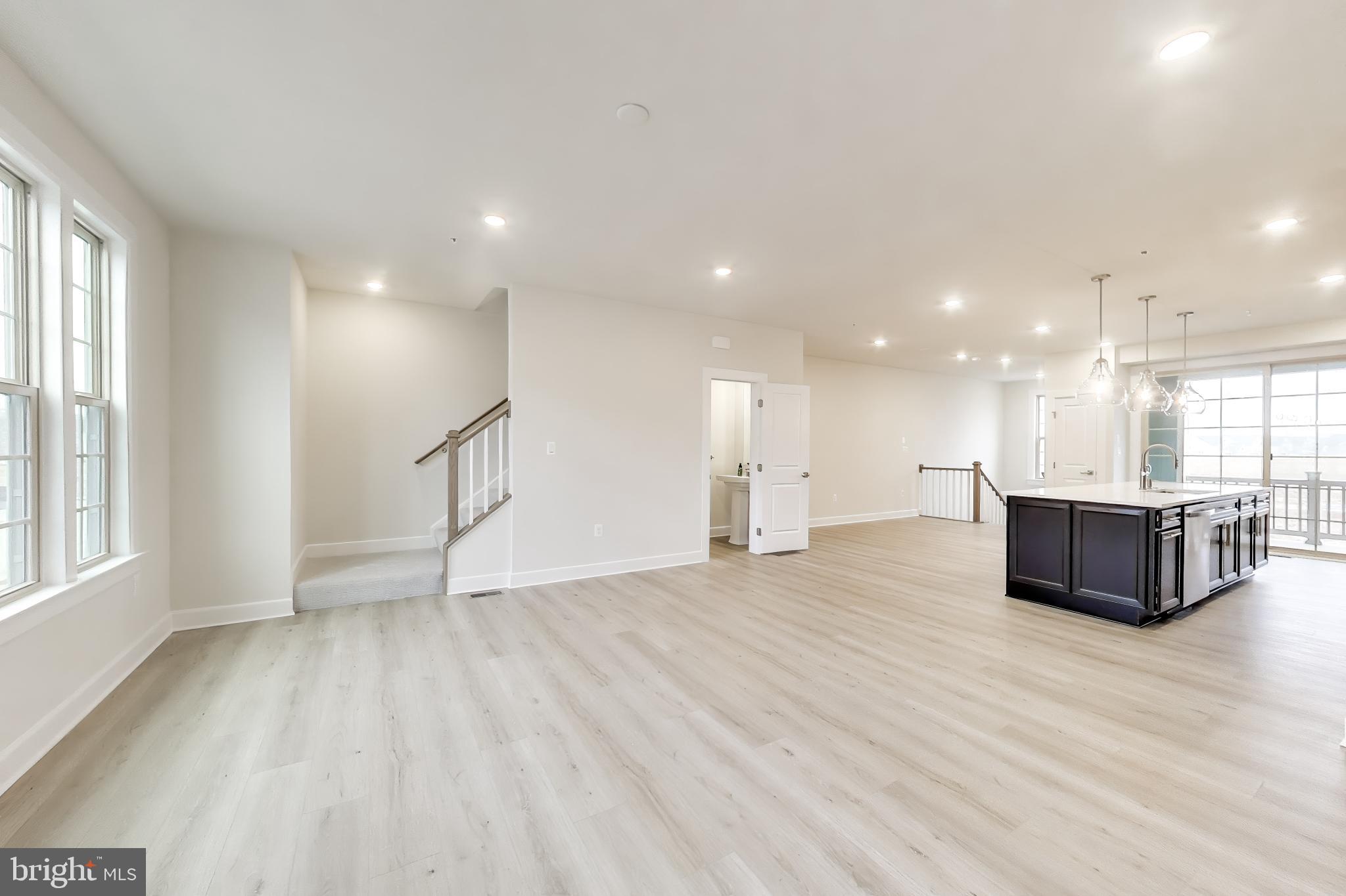 1774 Mill Branch Drive Laurel, MD 20708 - Photo 11 of 42 a view of an empty room with wooden floor and a window