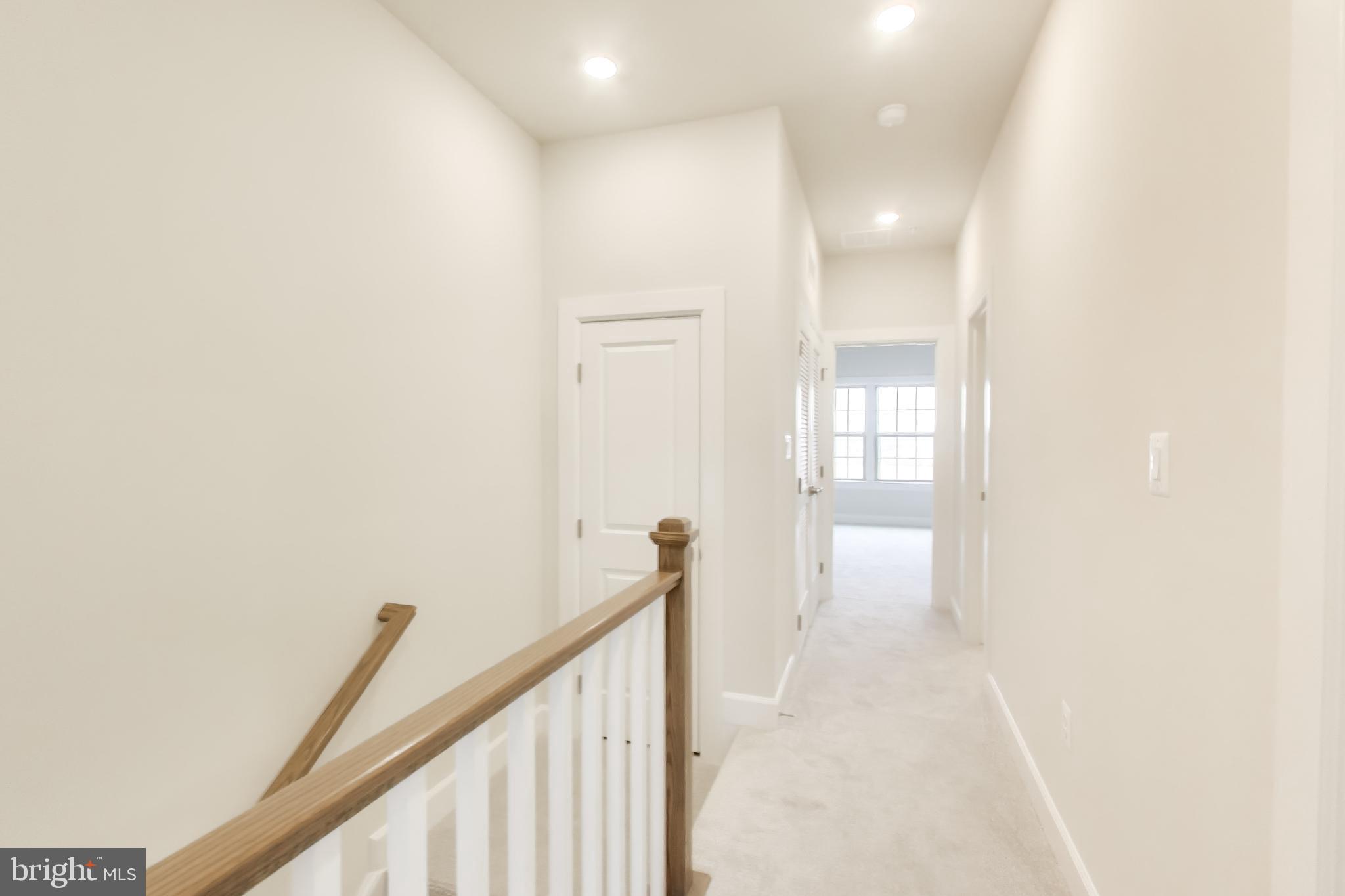 1774 Mill Branch Drive Laurel, MD 20708 - Photo 22 of 42 a view of a hallway with a white walls