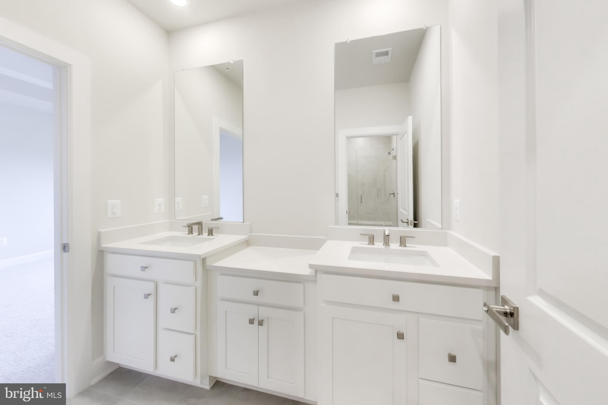 1774 Mill Branch Drive Laurel, MD 20708 - Photo 26 of 42 a spacious bathroom with a double vanity sink mirror and