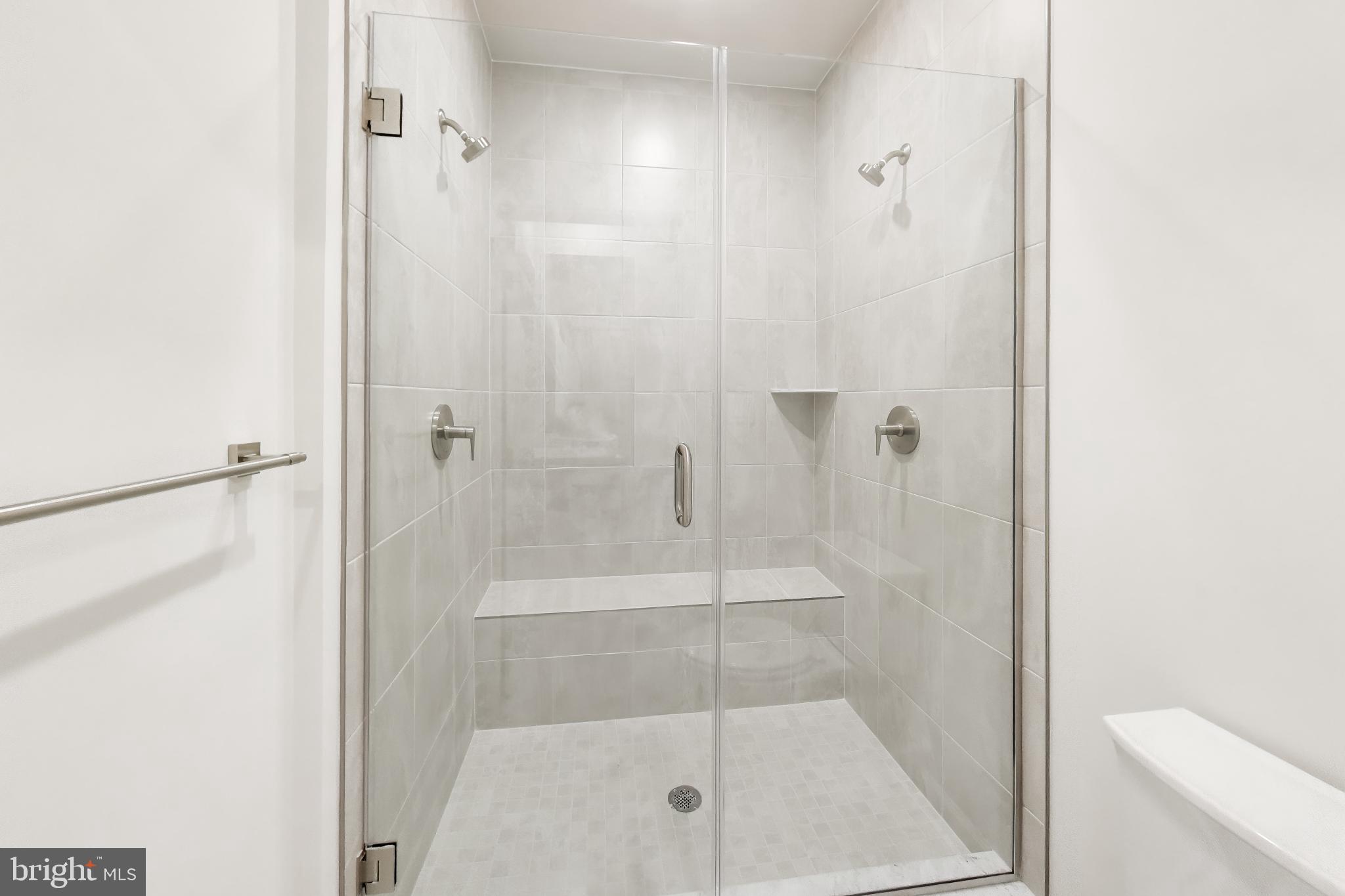 1774 Mill Branch Drive Laurel, MD 20708 - Photo 27 of 42 a bathroom with a glass shower door
