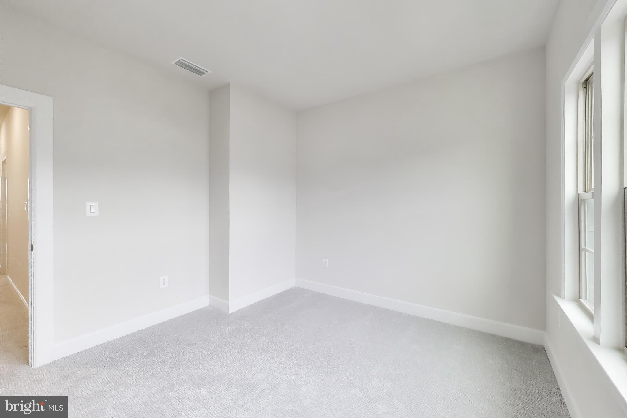 1774 Mill Branch Drive Laurel, MD 20708 - Photo 30 of 42 a view of an empty room and a window