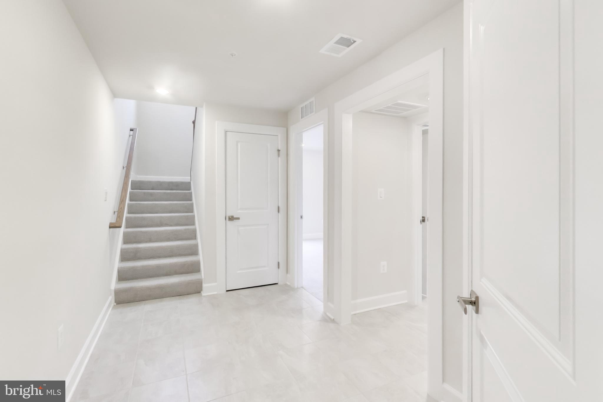 1774 Mill Branch Drive Laurel, MD 20708 - Photo 3 of 42 a view of an empty room with stairs