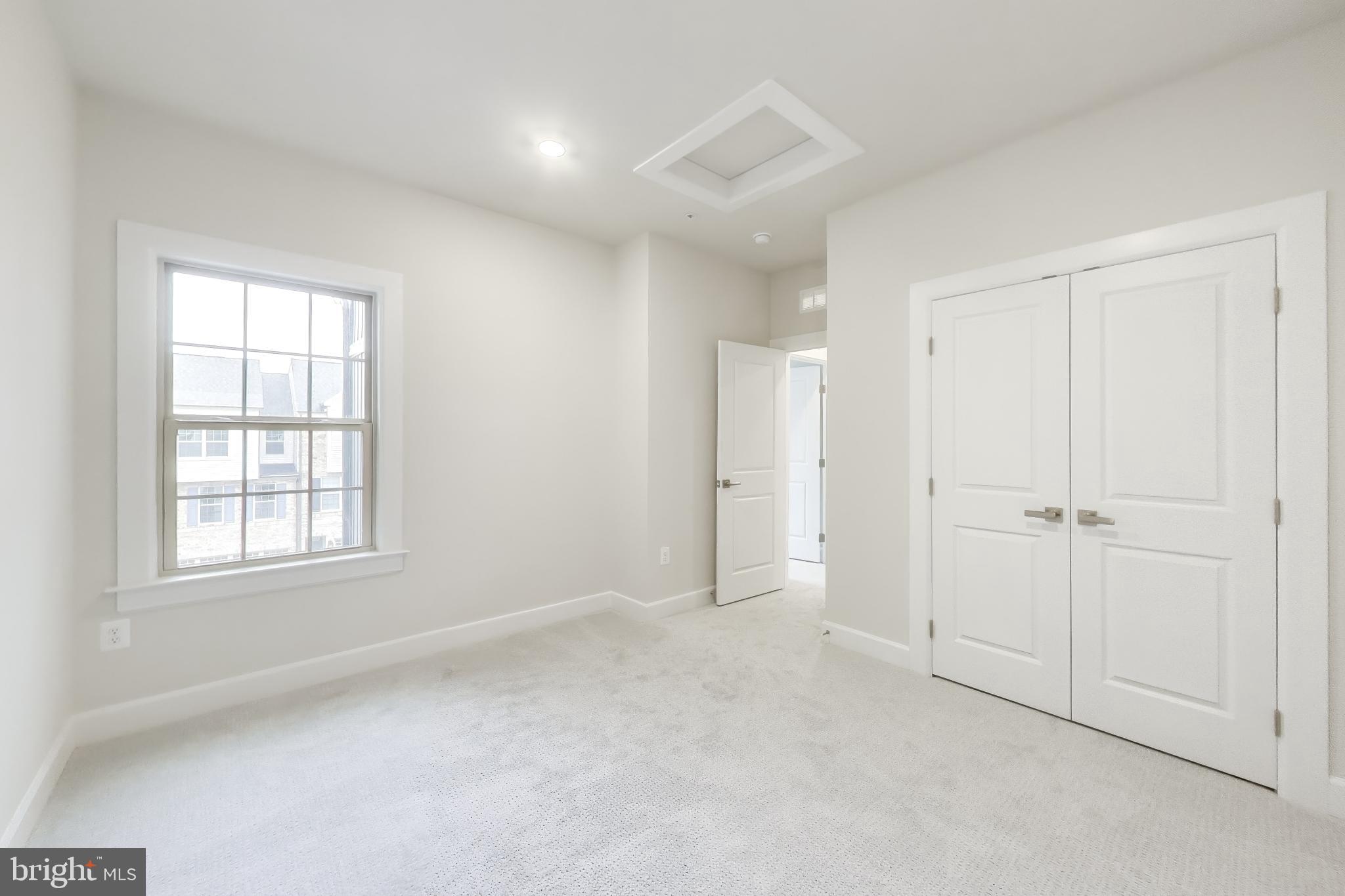 1774 Mill Branch Drive Laurel, MD 20708 - Photo 33 of 42 an empty room with windows and closet