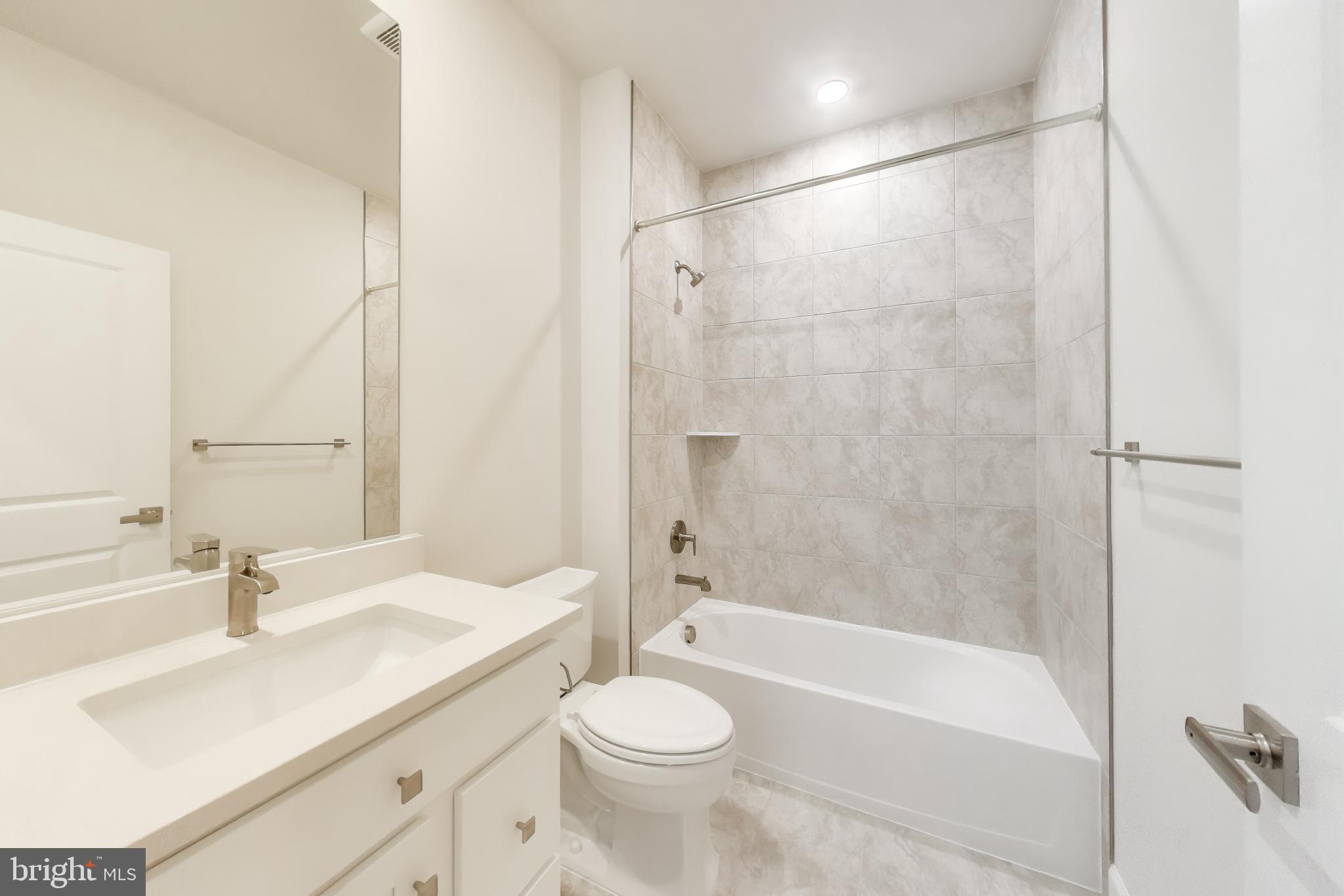 1774 Mill Branch Drive Laurel, MD 20708 - Photo 34 of 42 a bathroom with a sink a toilet and a bathtub