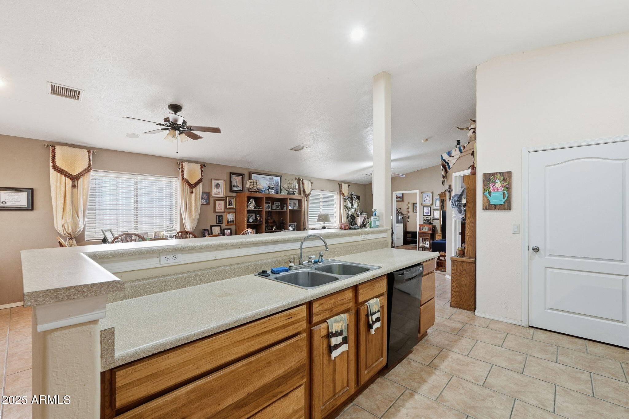 53607 West Moondust Road Maricopa, AZ 85139 - Photo 15 of 38 a kitchen with stainless steel appliances granite countertop a sink and cabinets