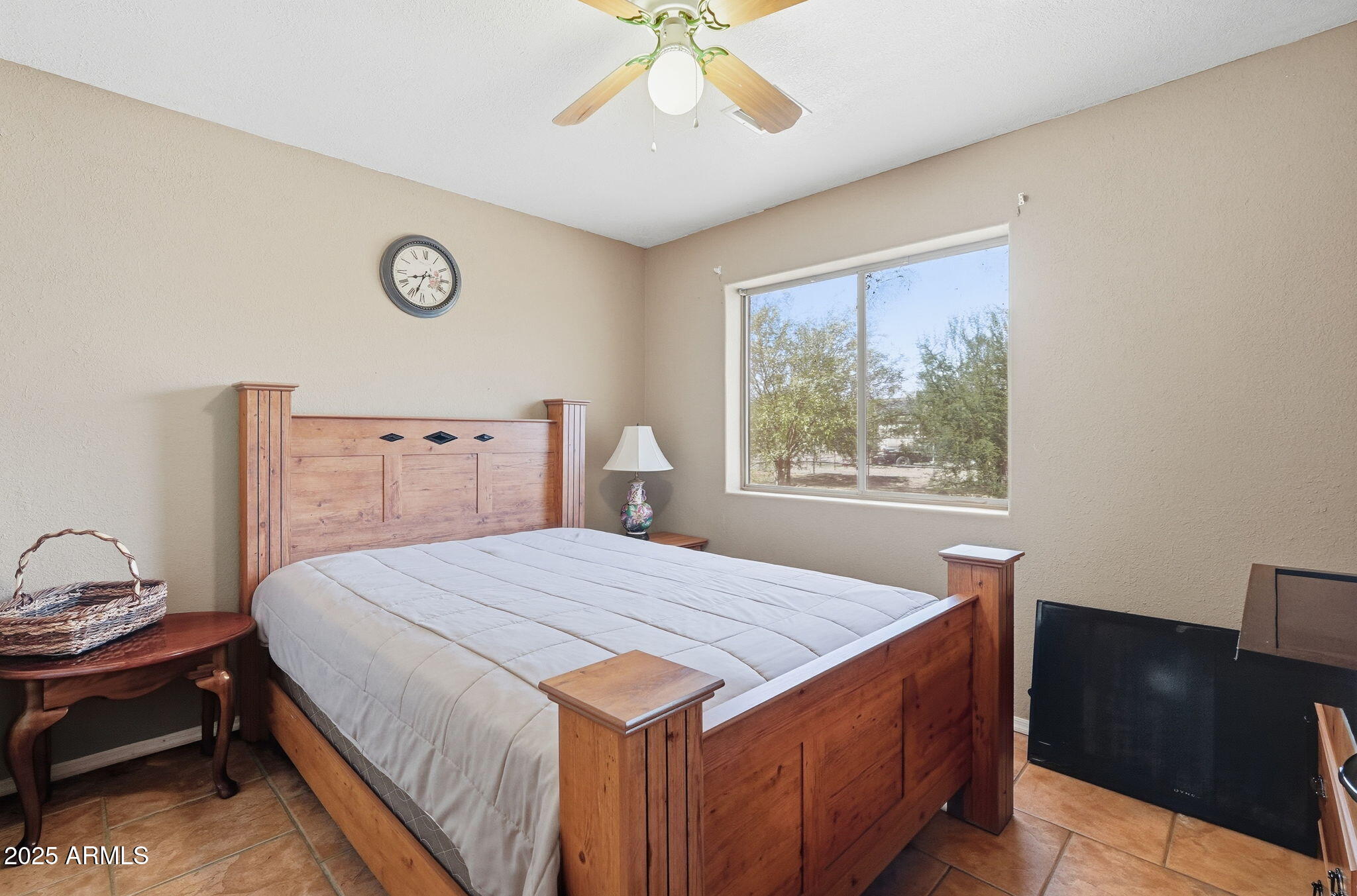 53607 West Moondust Road Maricopa, AZ 85139 - Photo 18 of 38 a bedroom with a bed and a window