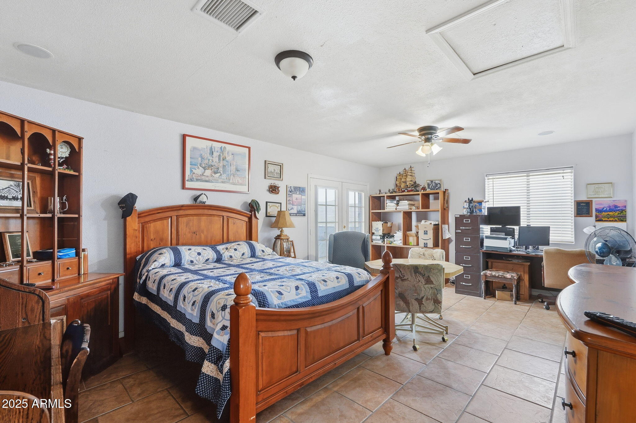 53607 West Moondust Road Maricopa, AZ 85139 - Photo 19 of 38 a bedroom with a bed and furniture