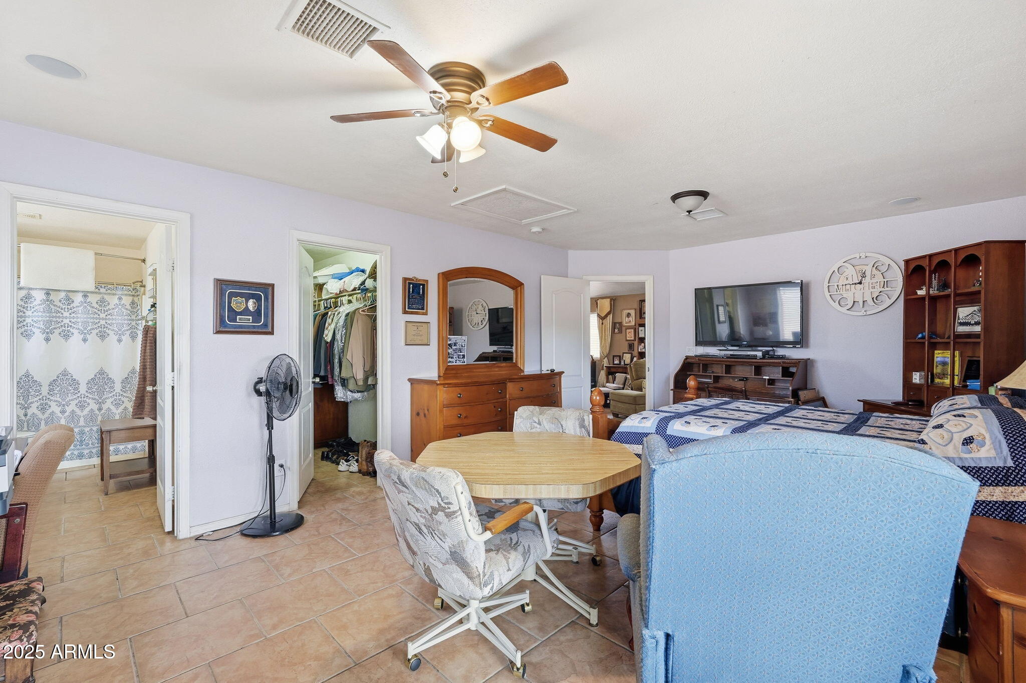 53607 West Moondust Road Maricopa, AZ 85139 - Photo 22 of 38 a view of a livingroom with furniture and a flat screen tv