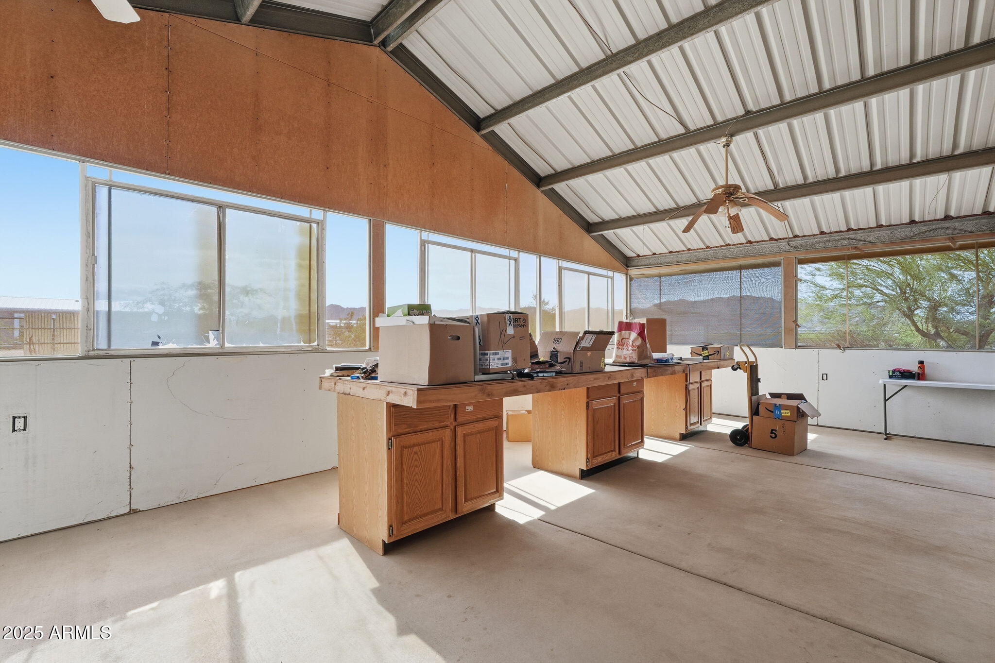 53607 West Moondust Road Maricopa, AZ 85139 - Photo 26 of 38 a kitchen with sink a window and chairs