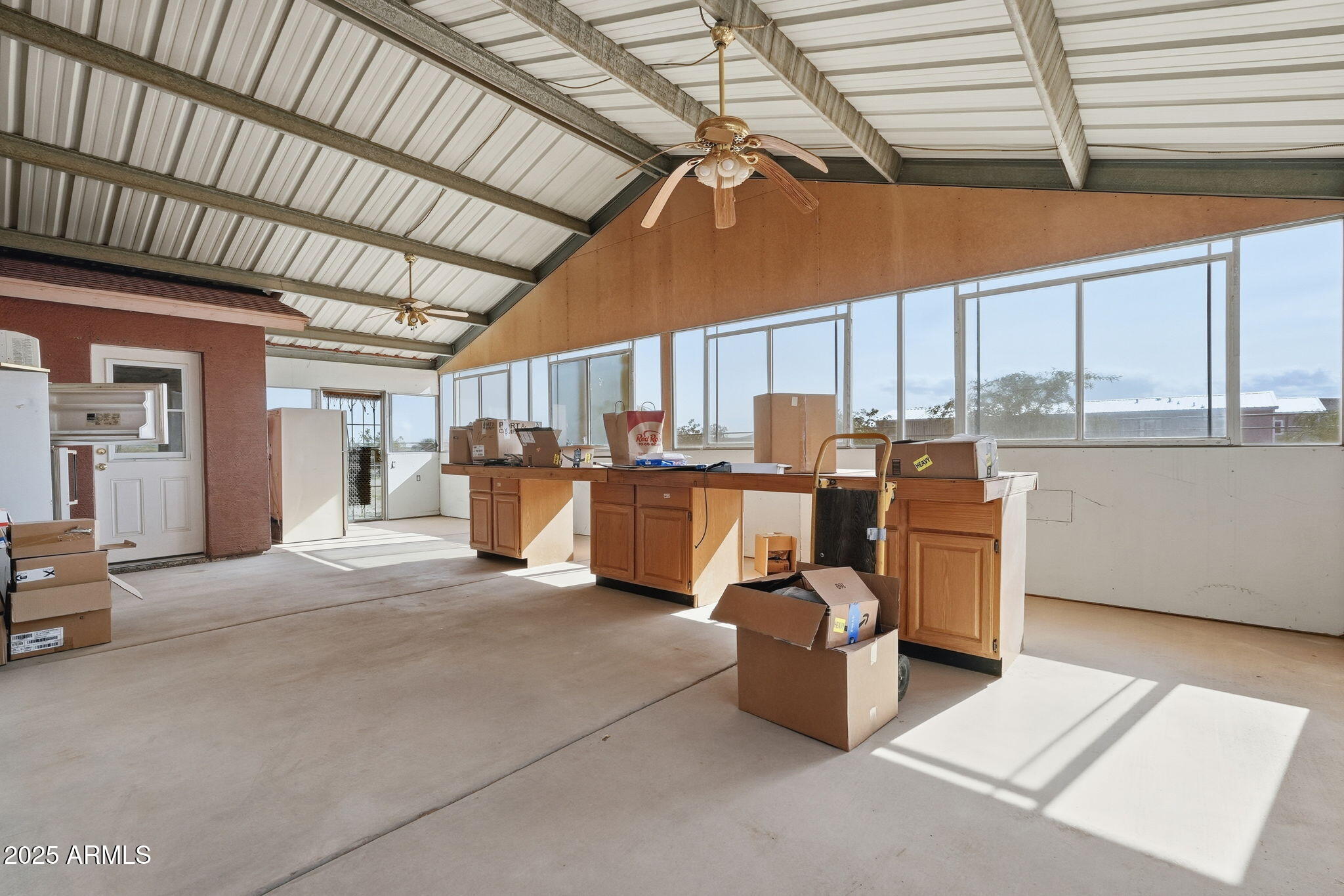 53607 West Moondust Road Maricopa, AZ 85139 - Photo 27 of 38 a room with lots of appliances and furniture
