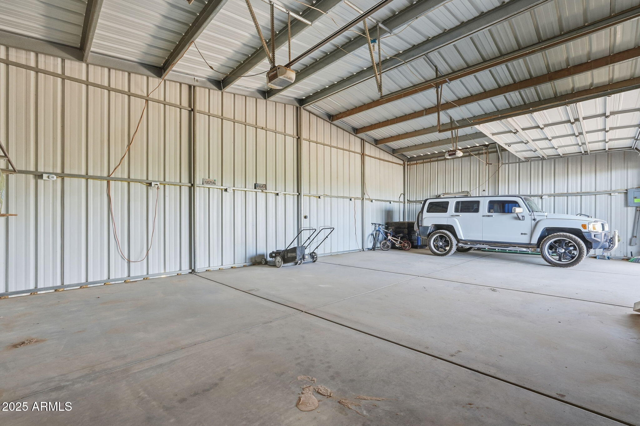 53607 West Moondust Road Maricopa, AZ 85139 - Photo 31 of 38 a car parked in a garage