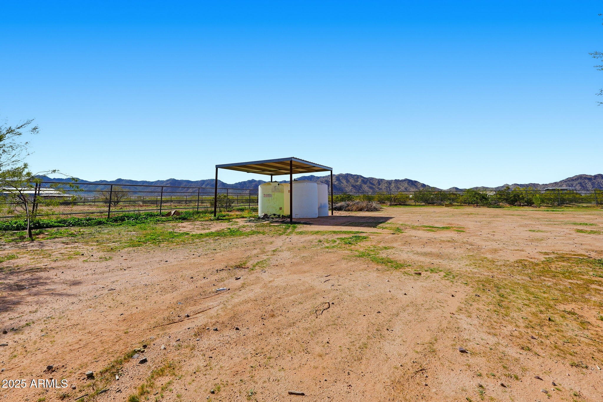 53607 West Moondust Road Maricopa, AZ 85139 - Photo 34 of 38 a view of a lake with houses in the background