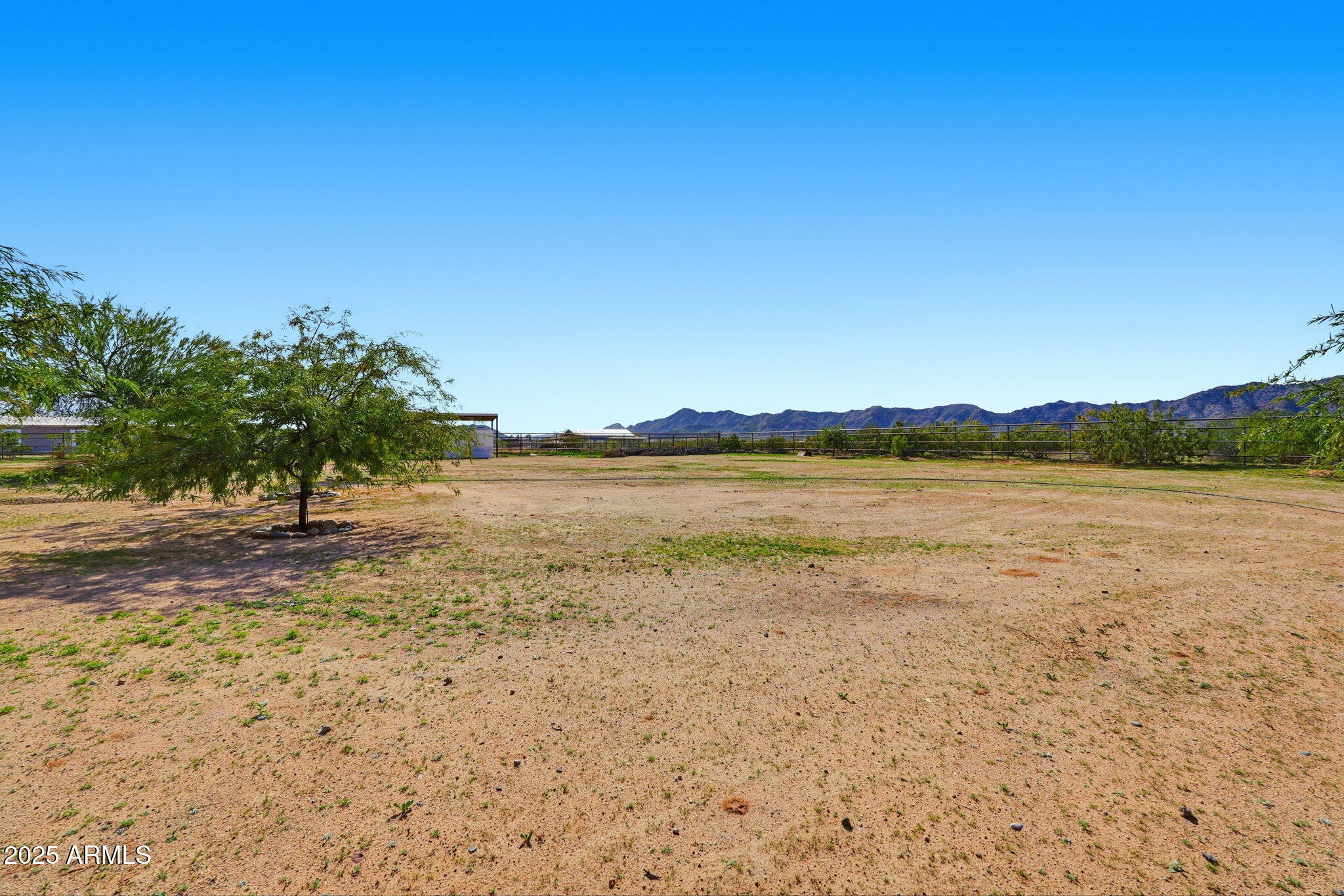 53607 West Moondust Road Maricopa, AZ 85139 - Photo 36 of 38 a view of a lake with houses in the background