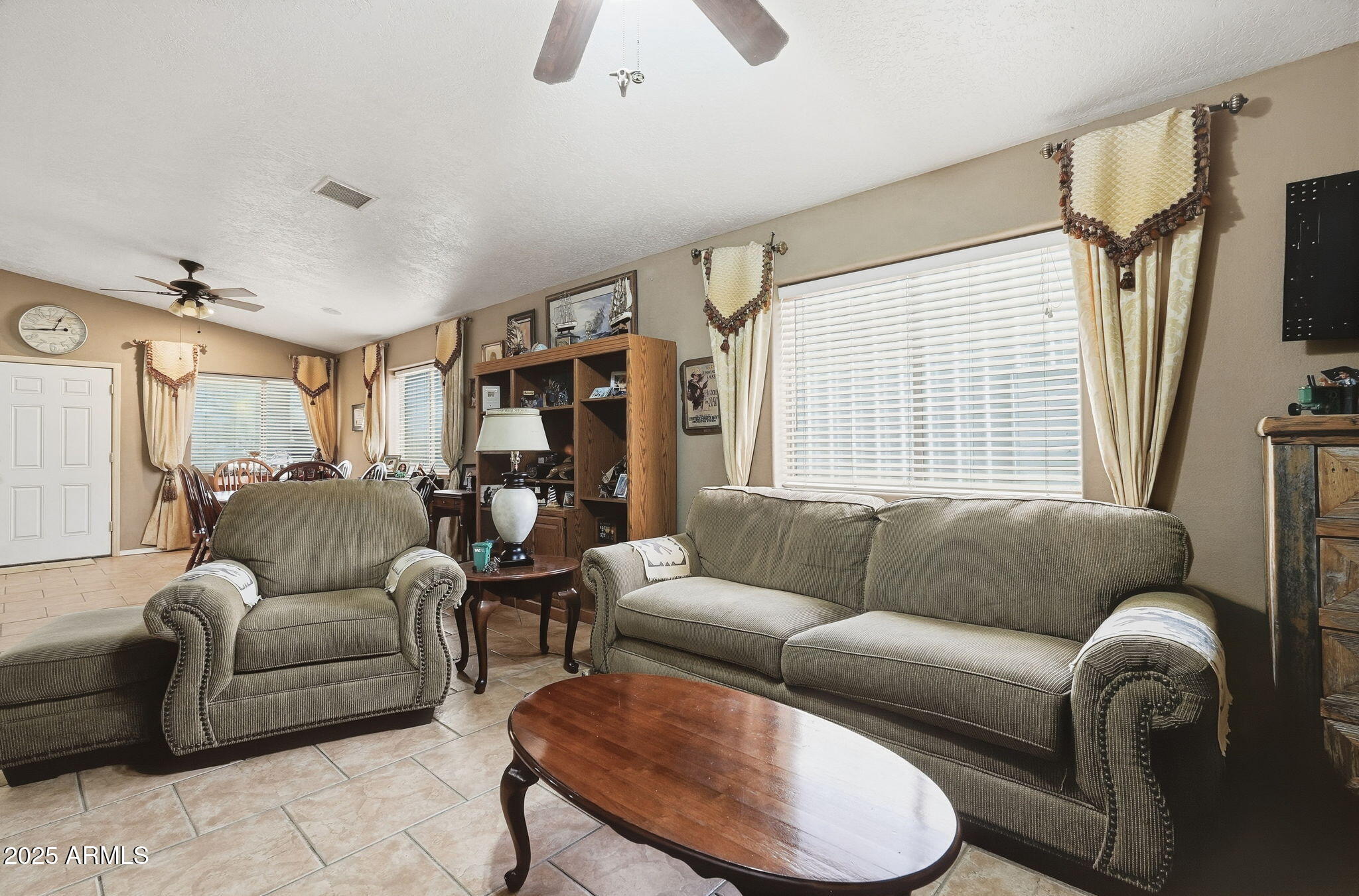 53607 West Moondust Road Maricopa, AZ 85139 - Photo 6 of 38 a living room with furniture and a large window