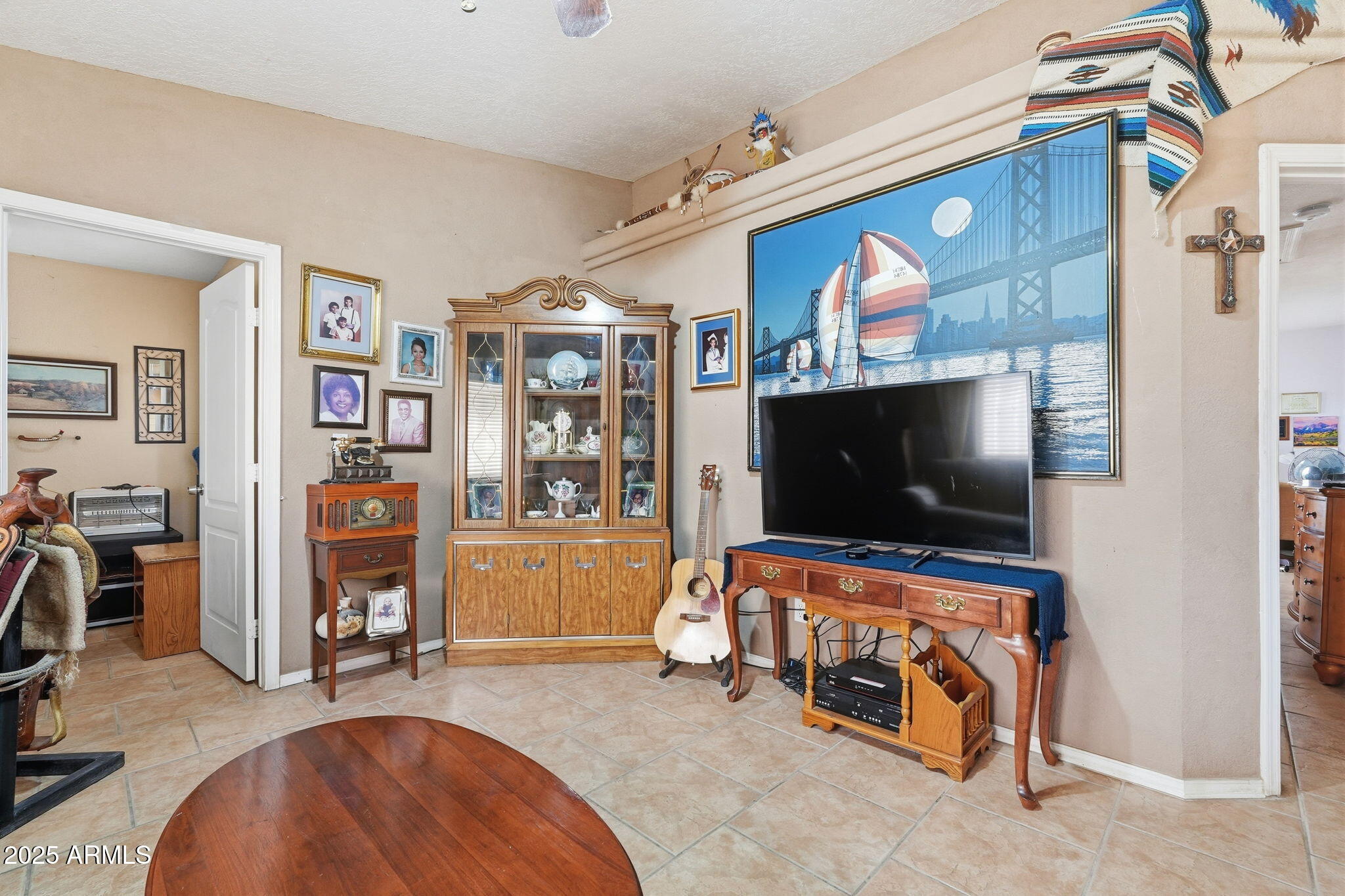 53607 West Moondust Road Maricopa, AZ 85139 - Photo 8 of 38 a living room with furniture and a flat screen tv
