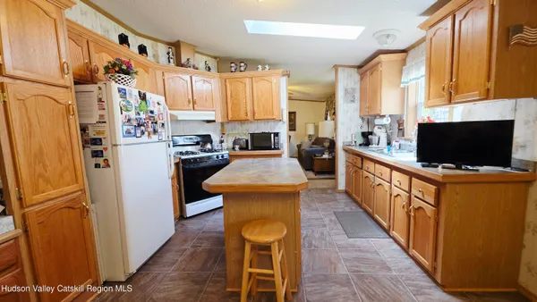a white toilet sitting next to a bathroom sink and tub