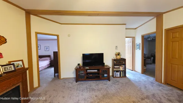 a front view of a house with a garden and trees