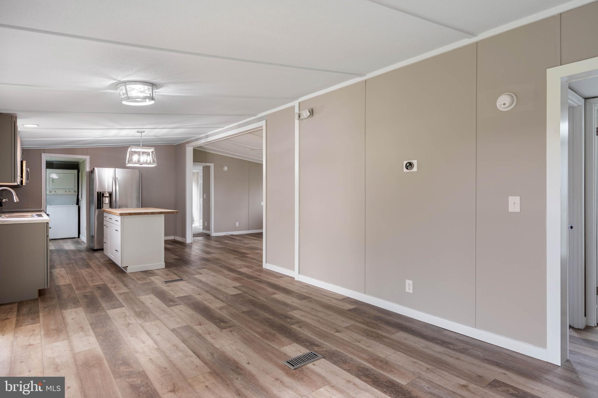 31392 Oak Street Ocean View, DE 19970 - Photo 17 of 38 a view of a kitchen with wooden floor and a window