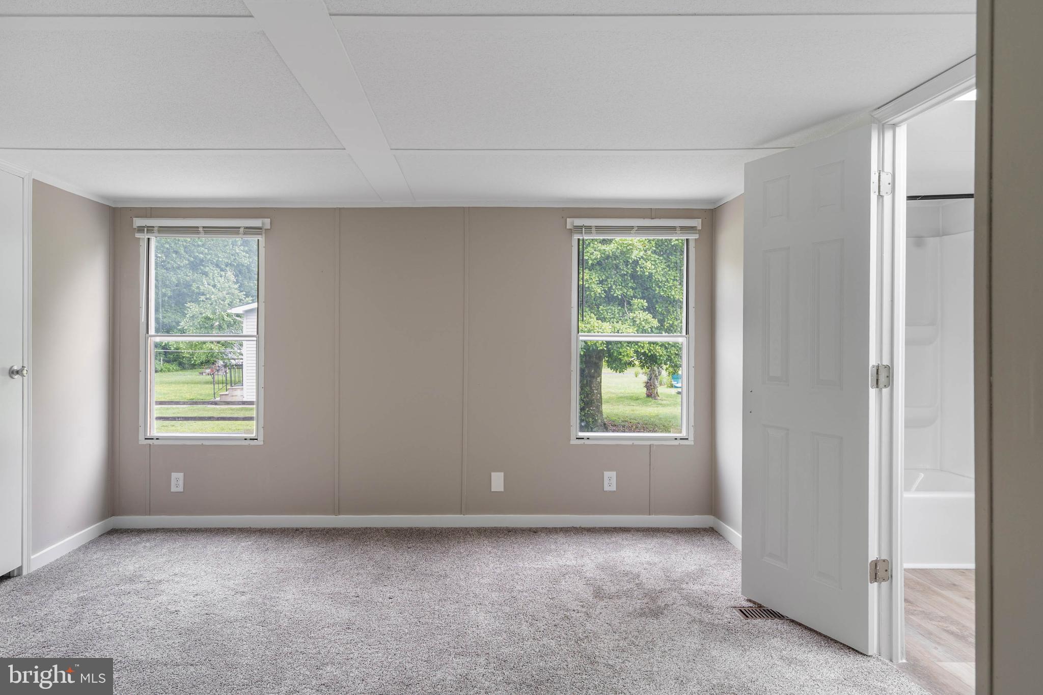 31392 Oak Street Ocean View, DE 19970 - Photo 18 of 38 an empty room with windows