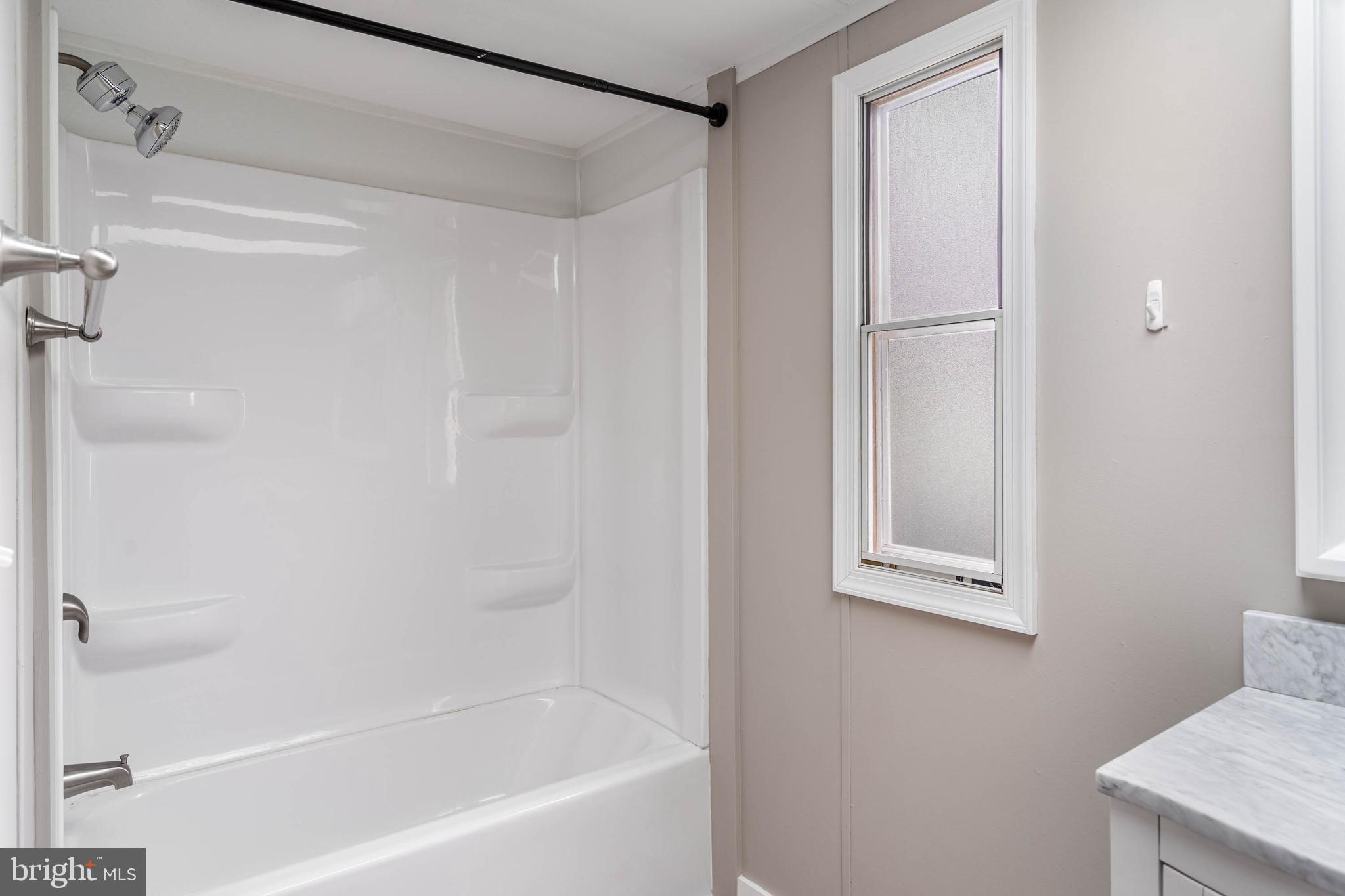 31392 Oak Street Ocean View, DE 19970 - Photo 21 of 38 a bathroom with a bathtub