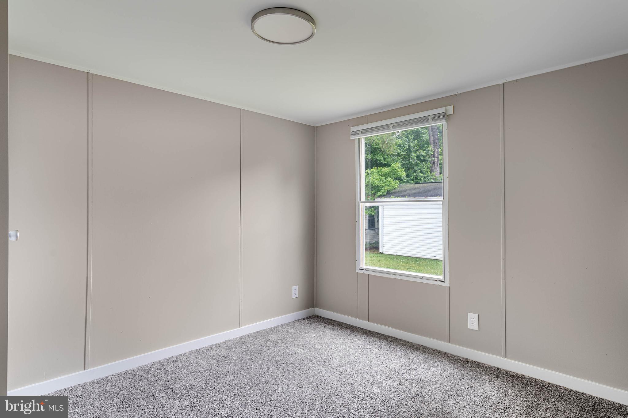 31392 Oak Street Ocean View, DE 19970 - Photo 22 of 38 a view of an empty room with a window