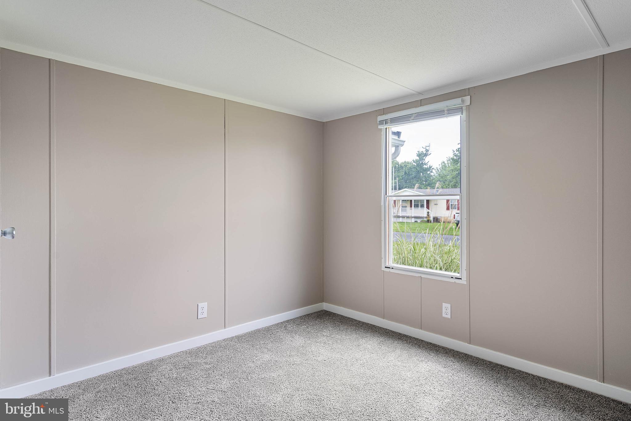 31392 Oak Street Ocean View, DE 19970 - Photo 26 of 38 an empty room with windows