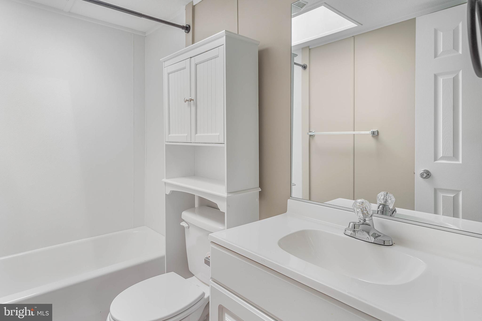 31392 Oak Street Ocean View, DE 19970 - Photo 27 of 38 a bathroom with a sink toilet and shower