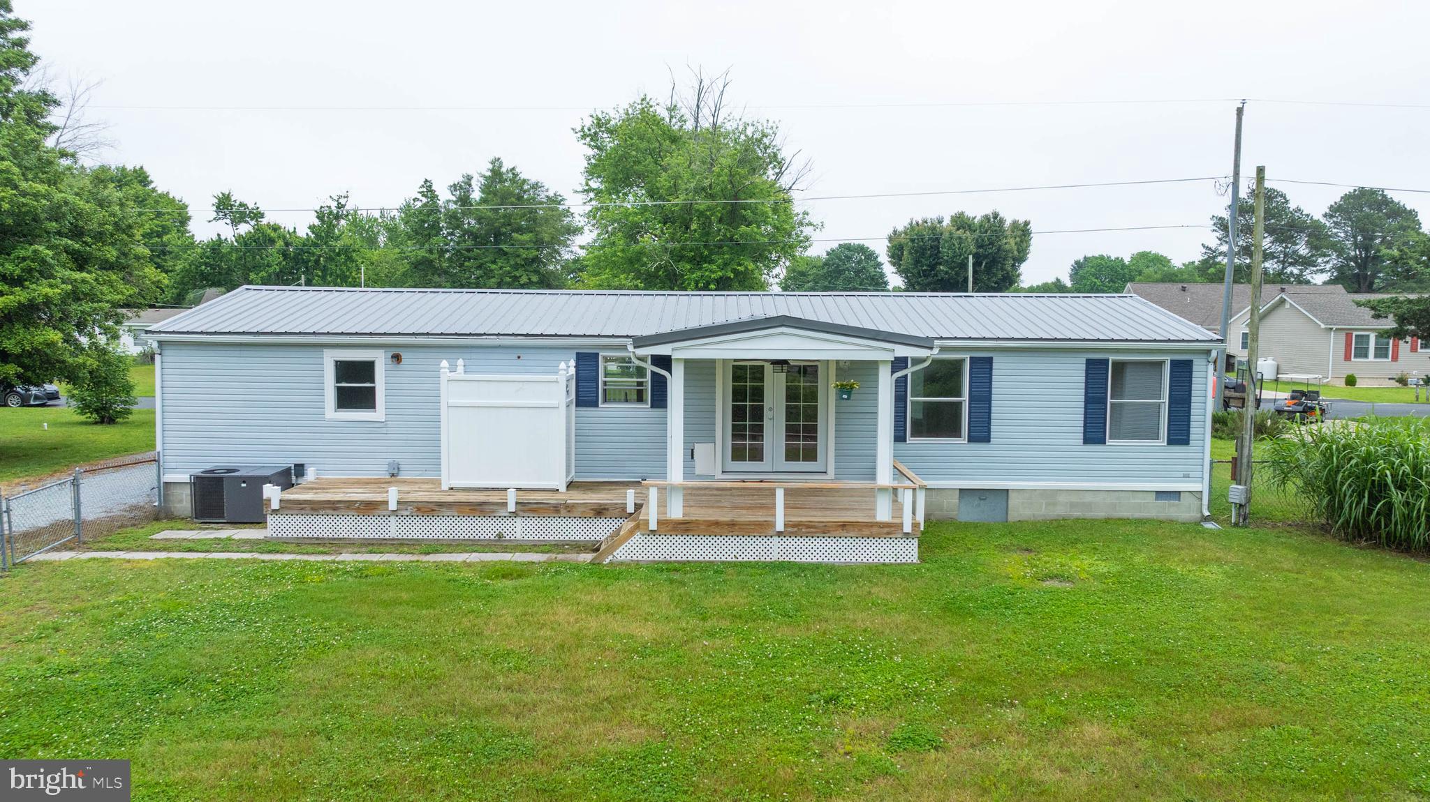 31392 Oak Street Ocean View, DE 19970 - Photo 29 of 38 a front view of house with a garden and patio