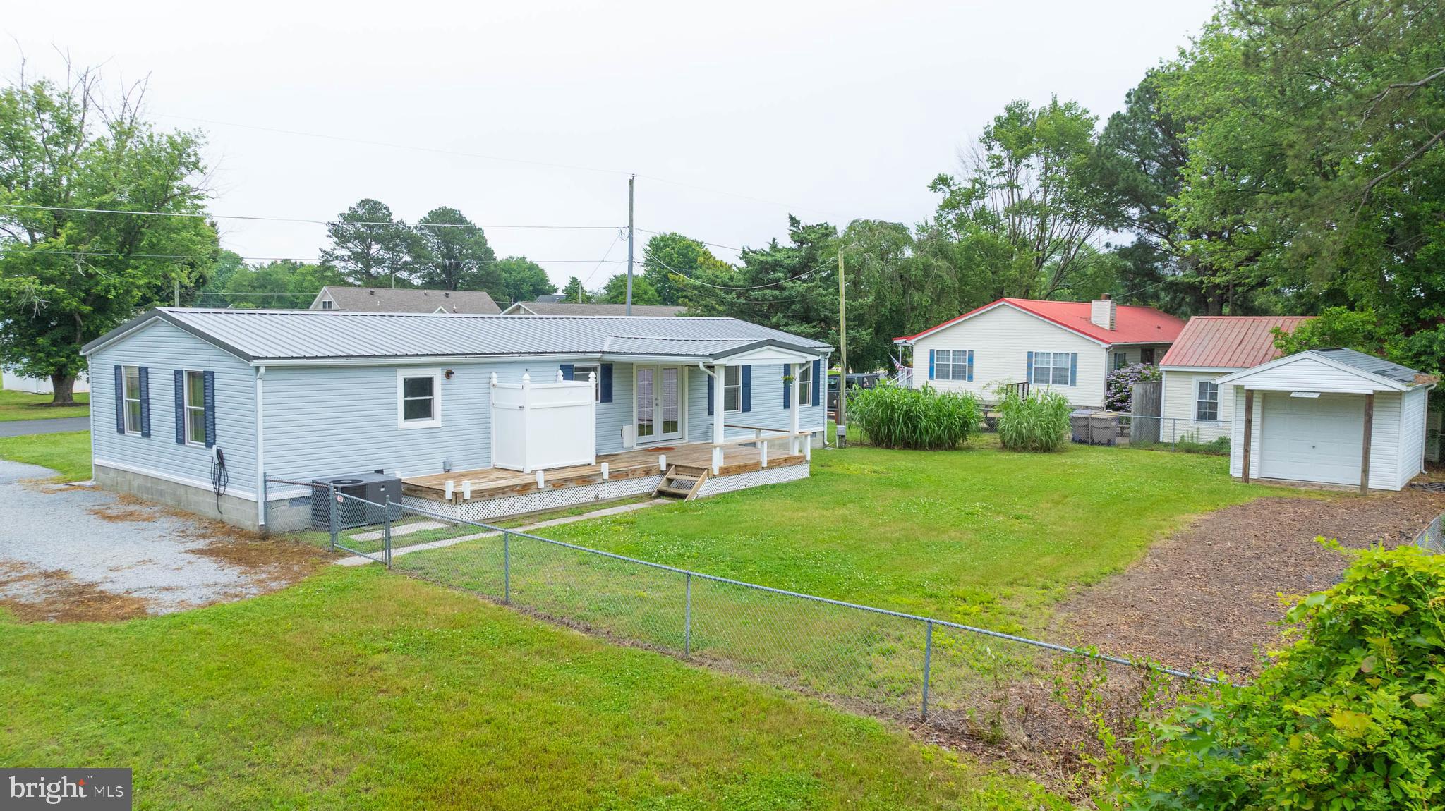 31392 Oak Street Ocean View, DE 19970 - Photo 31 of 38 a front view of a house with yard patio and green space