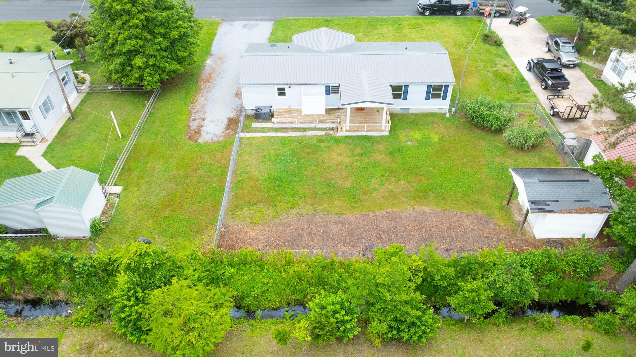31392 Oak Street Ocean View, DE 19970 - Photo 34 of 38 an aerial view of residential houses with outdoor space and swimming pool