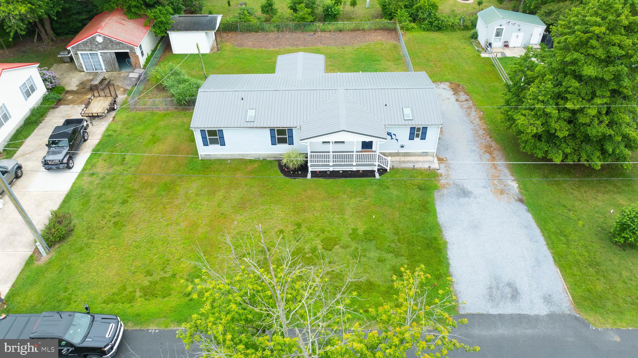 31392 Oak Street Ocean View, DE 19970 - Photo 36 of 38 an aerial view of a house with pool big yard and large trees