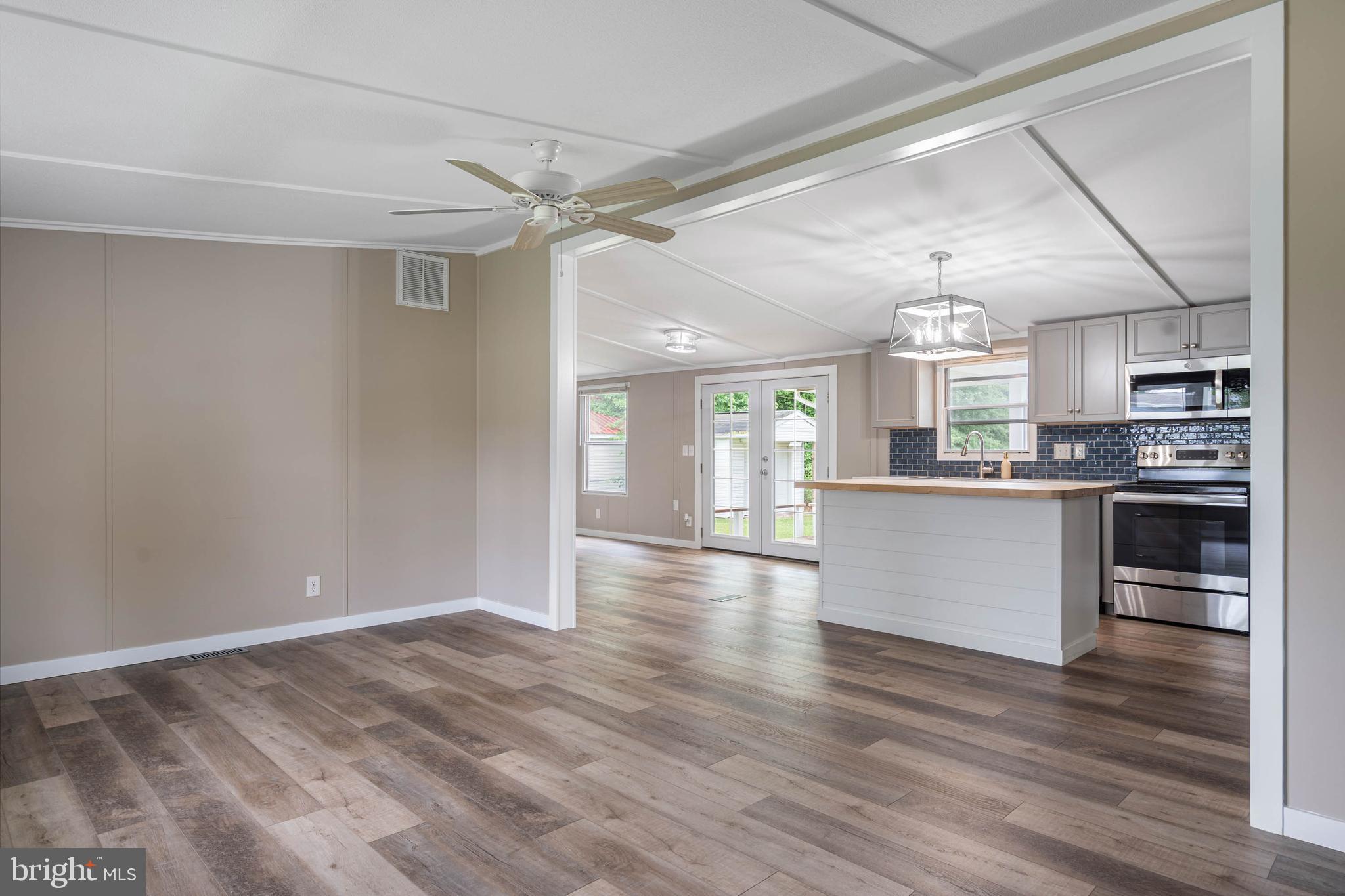 31392 Oak Street Ocean View, DE 19970 - Photo 5 of 38 a view of a kitchen with a sink and stainless steel appliances