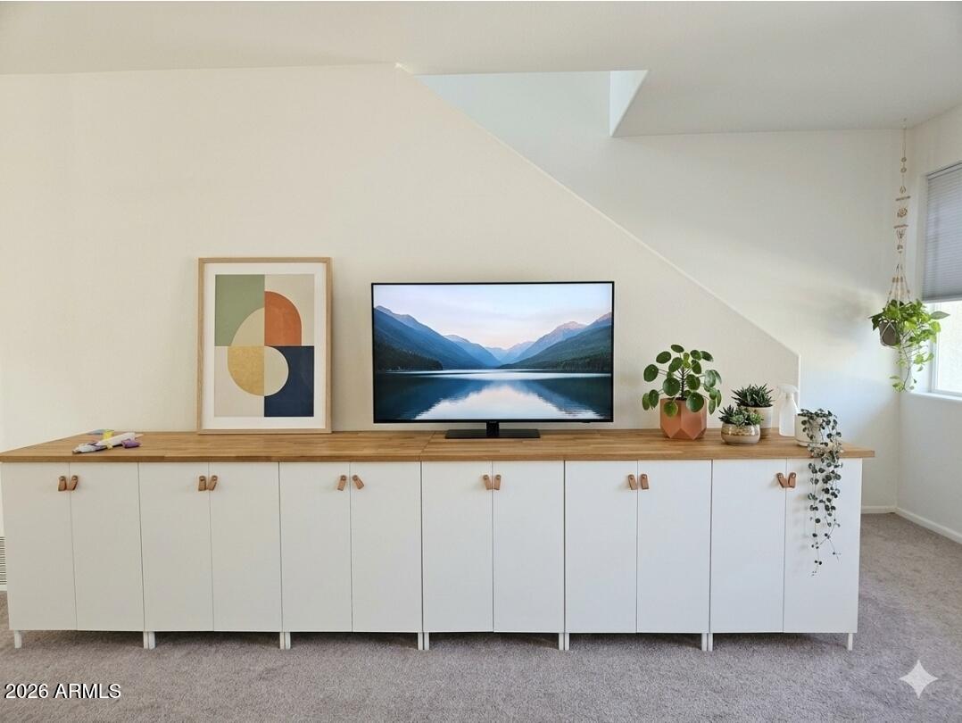 933 West Mercer Lane Phoenix, AZ 85029 - Photo 12 of 46 a living room with white cabinets and potted plant