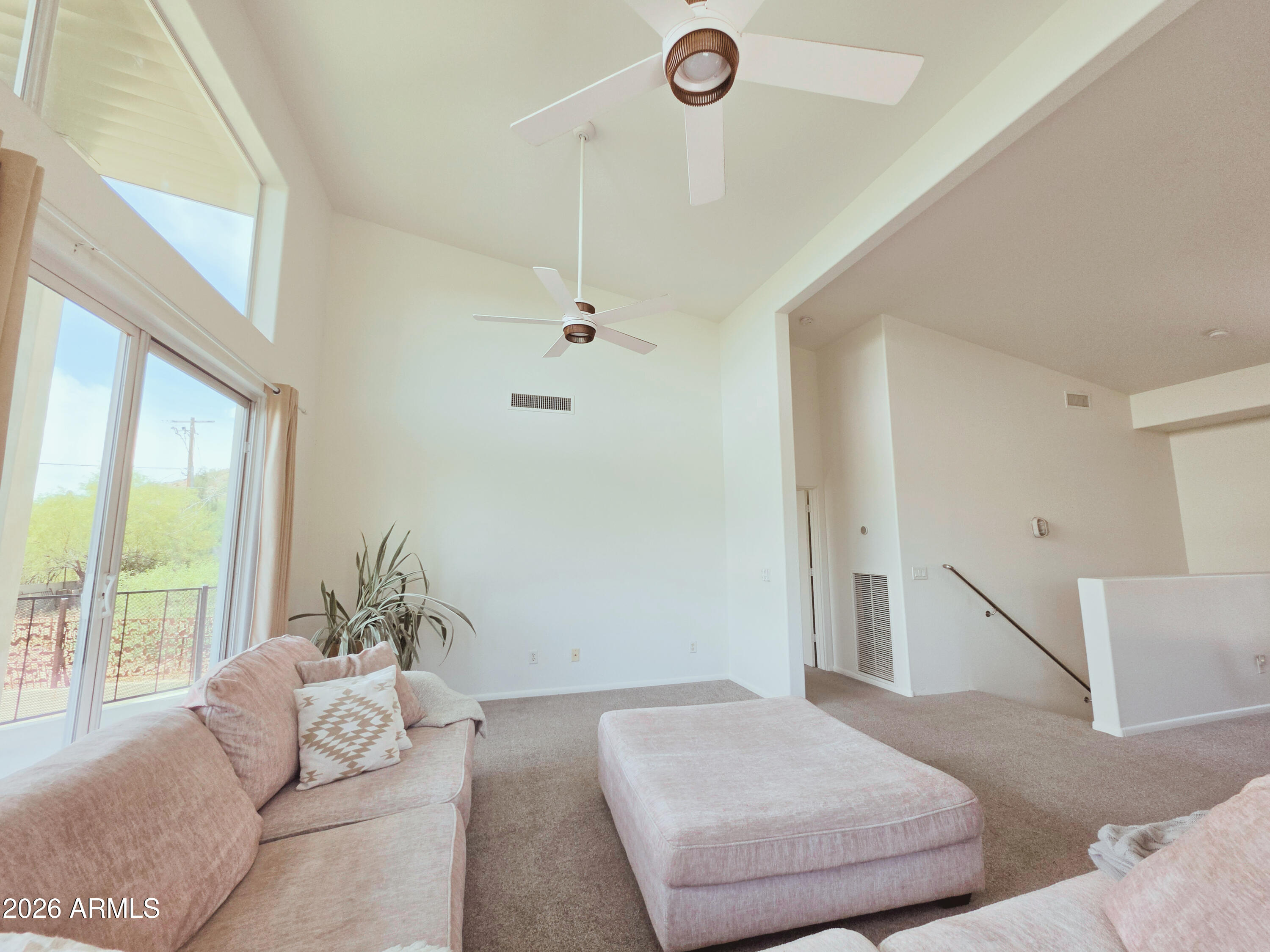 933 West Mercer Lane Phoenix, AZ 85029 - Photo 22 of 46 a living room with furniture and a large window